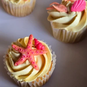 Vanilla Cupcakes with buttercream frosting and fondant starfish and shell decoration